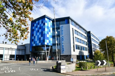 City College Plymouth's building with students outside