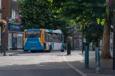 Stagecoach bus driving away on high street