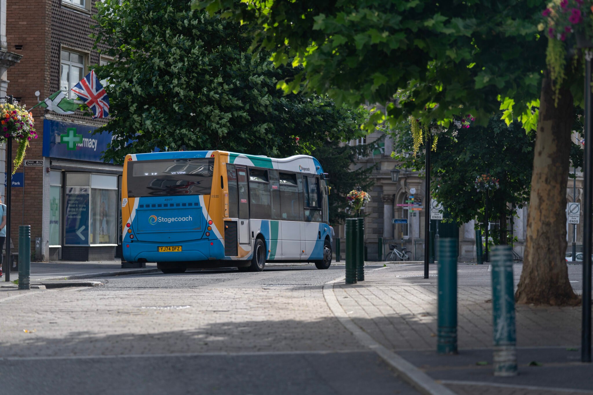 Stagecoach bus driving away on high street