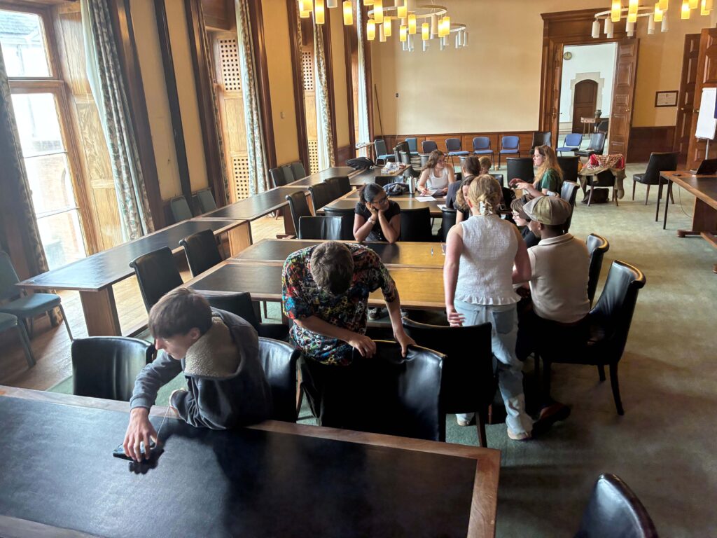 Members of the Youth Council sat in discussion around tables in the County Hall committee suite